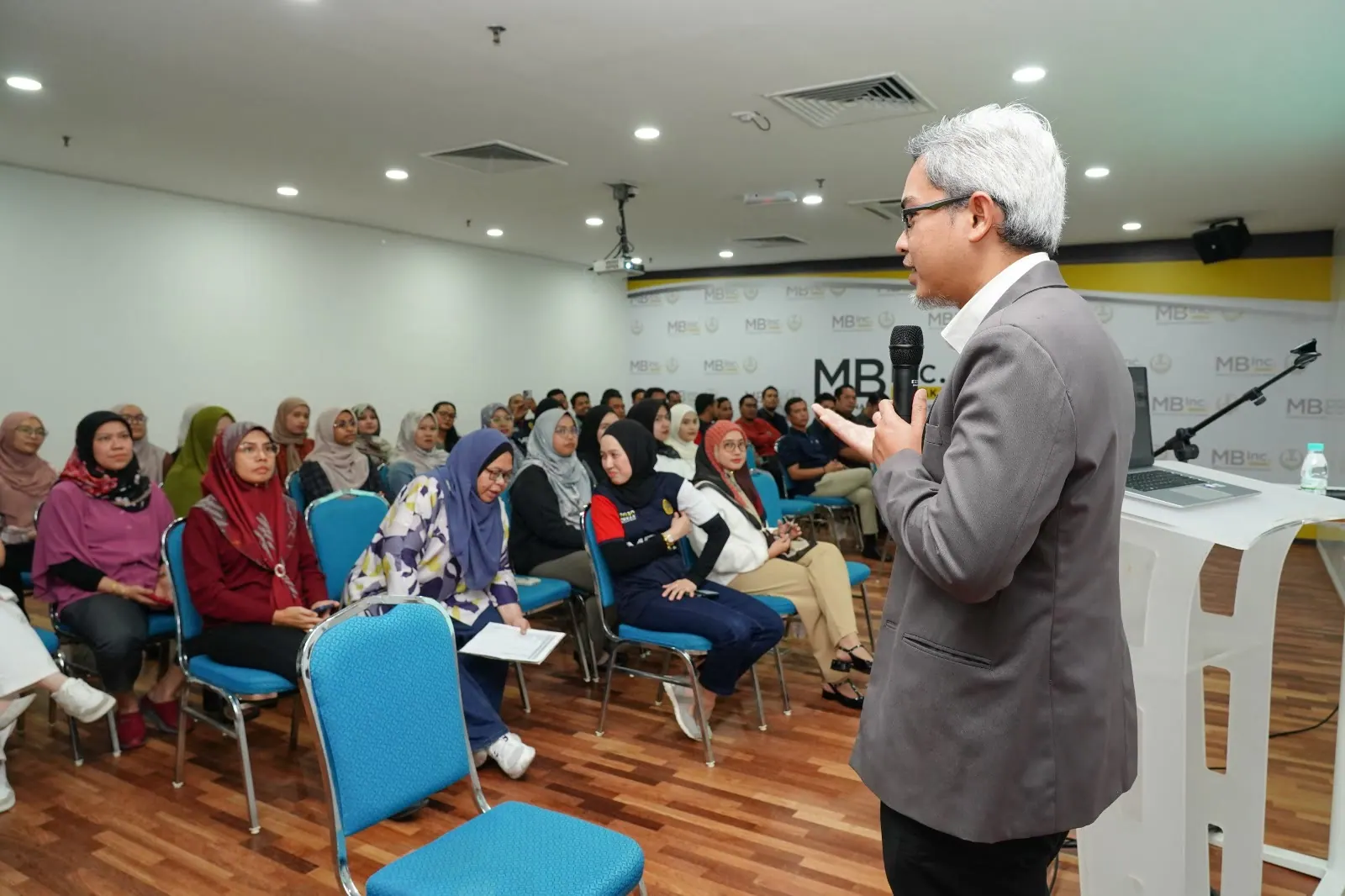 A Plus K principal consultant speaking with a workplace audience